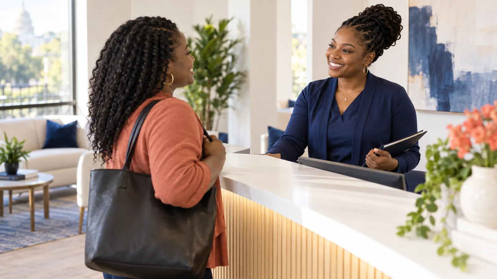 A care coordinator welcoming a new visitor